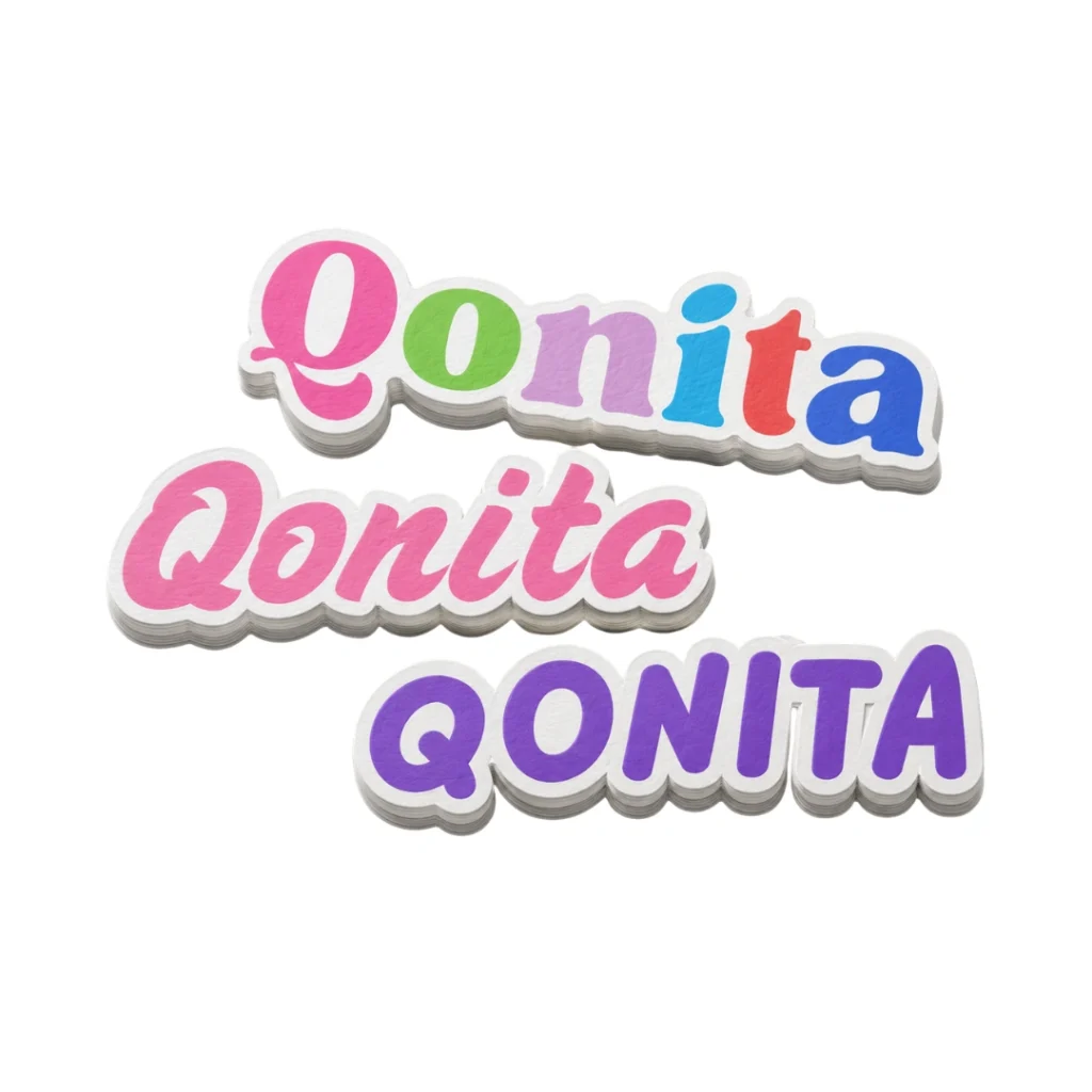 Tiga tumpukan sticker nama custom diecut tulisan Qonita variasi warna-warni berlatar putih pada Sticker Nama Diecut custom