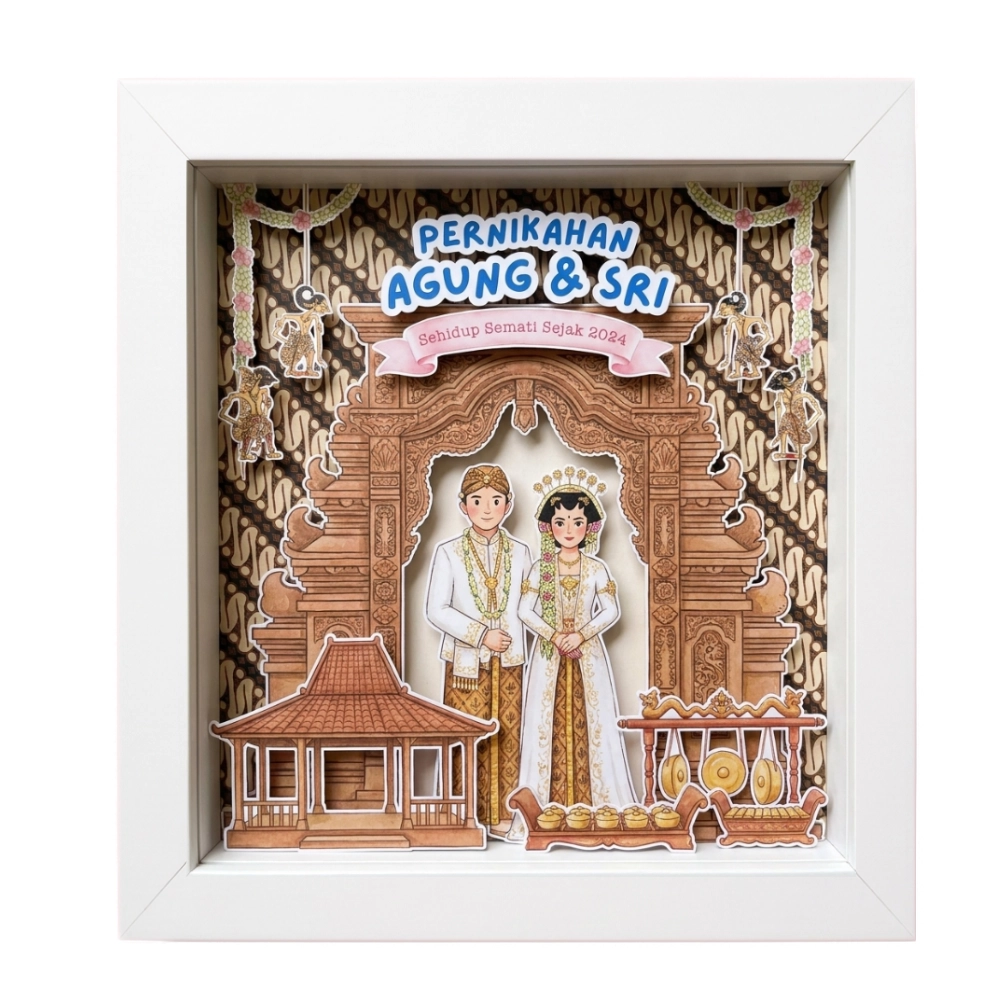 3d frame nikahan putih dengan ilustrasi kertas timbul pengantin Jawa, gapura, dan teks kustom di atas kabinet pink.